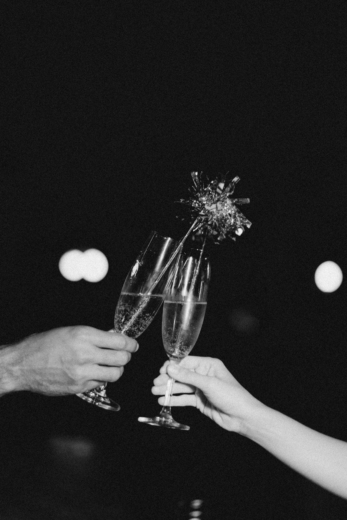 A celebratory toast with clinking champagne flutes
