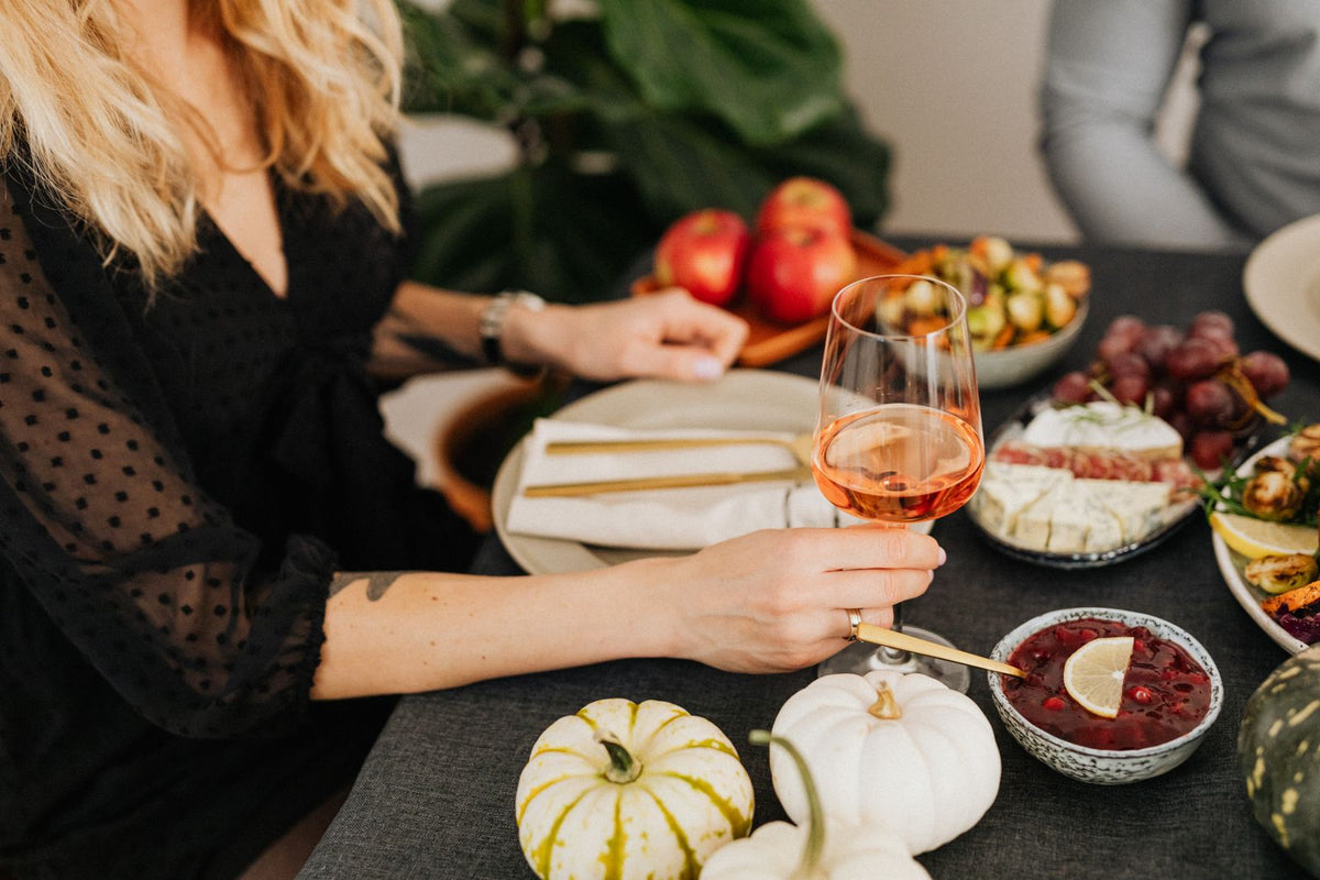 Glass of wine at a festive autumn holiday table