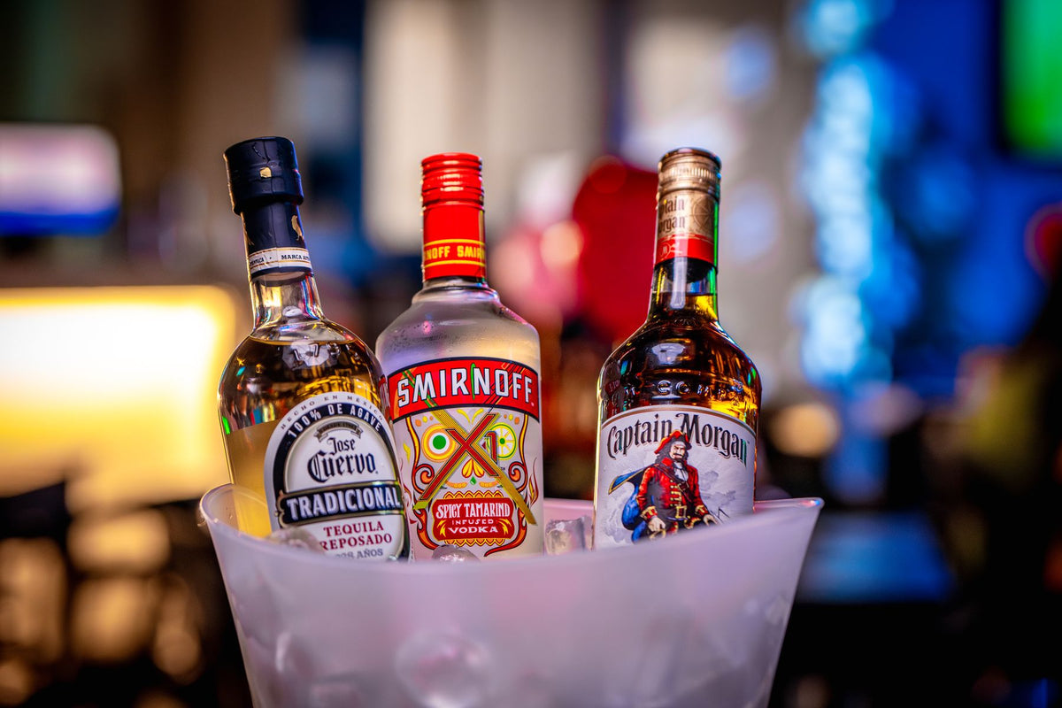 Bottles of spirits chilling in a bucket of ice