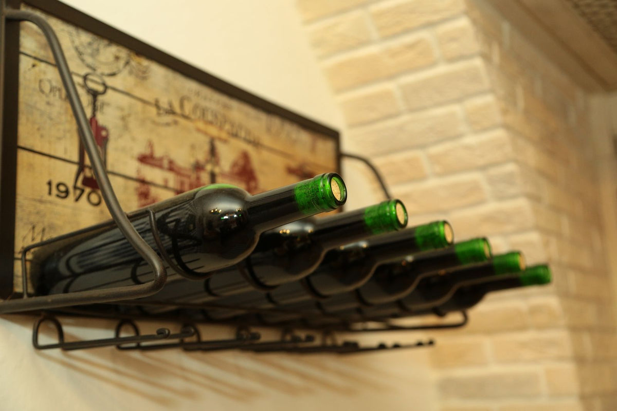 Wine bottles lying on their sides in a wooden rack