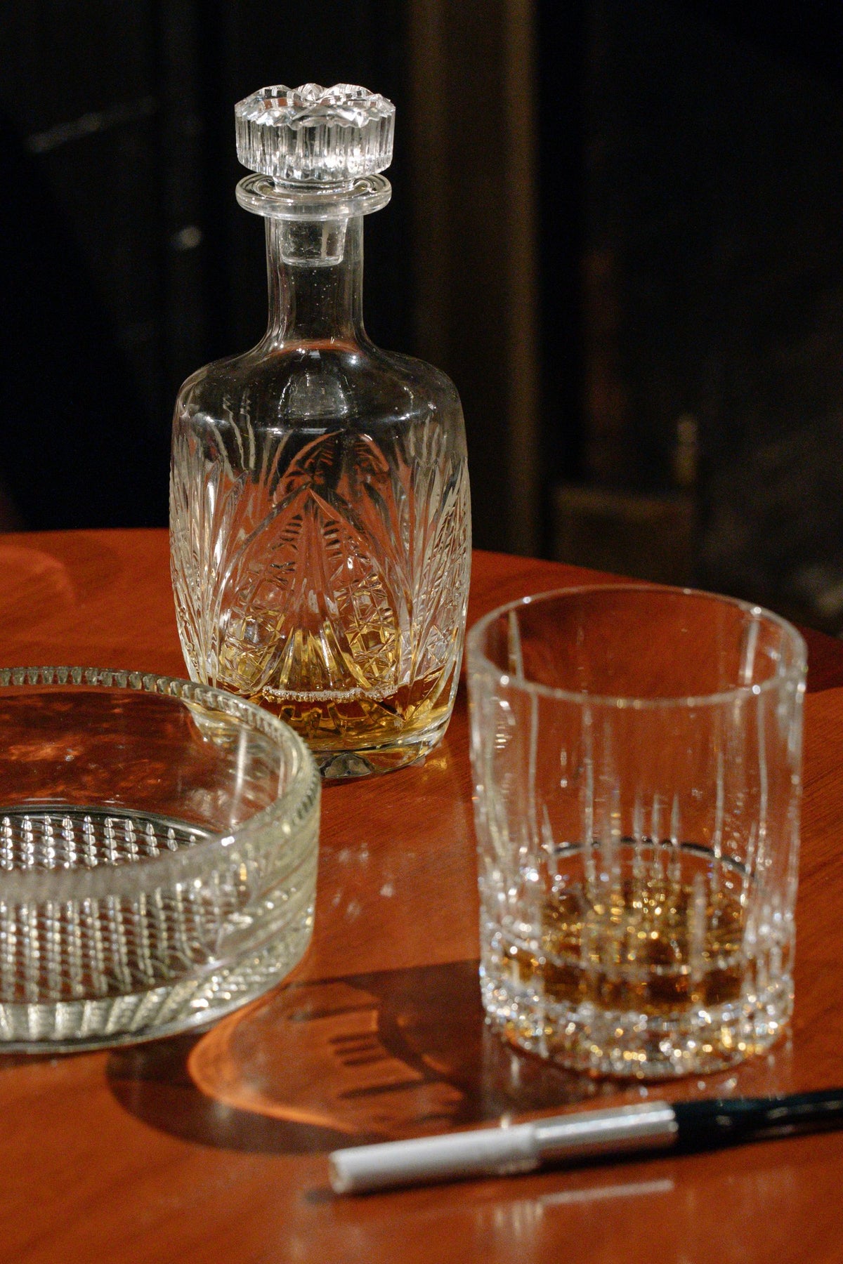 Whiskey decanter and glasses set on a wooden table
