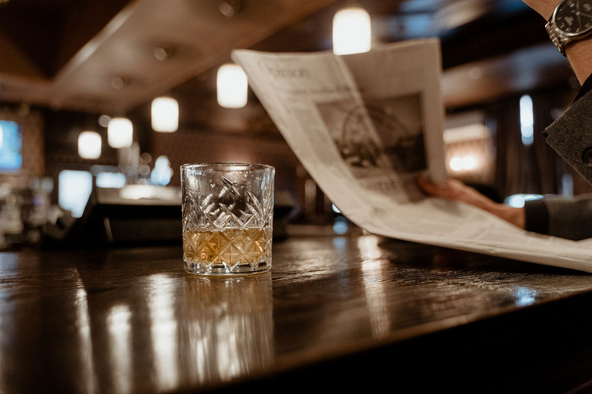Glass of whiskey on a bar counter
