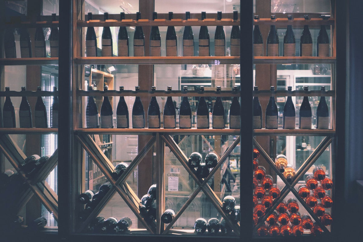 A market display of many different wine bottles side by side